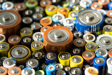 Close Up Of Positive Ends Of Discharged Batteries Of Different Sizes And Formats, Selective Focus. Used Battery For Recycling. Hazardous Garbage Concept