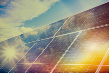 sunlit solar panels against blue sky. alternative energy source
