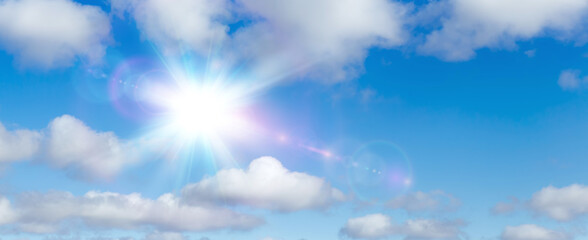 Natural summer background, sun over blue sky with white clouds.