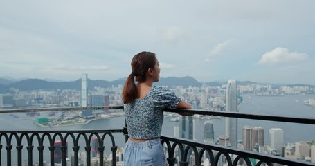 Poster - Woman enjoy the city view in Hong Kong