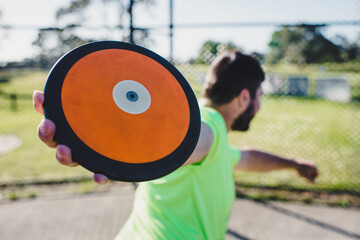 Discus thrower in cage