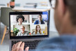 © ReeldealHD images - Person Using Video Conferencing technology for business meeting