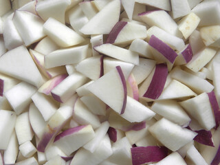 Wall Mural - White and purple color diced cut ripe Turnip root