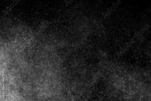 Fotografía Abstract splashes of water on black background