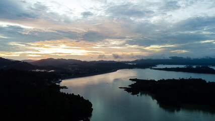 Aerial view of Kenyir Lake during blue hour sunrise.