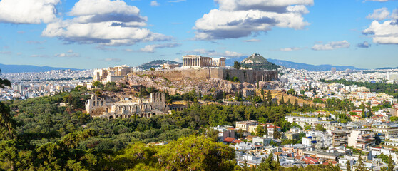 Wall Mural - Landscape of Athens, Greece. Panoramic scenic view of Acropolis hill with Ancient Greek ruins in Athens city center