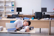 © Elnur - Young male employee unhappy with excessive work