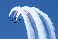 A Jet Flying Team, Single Seat Jet  Airplanes Flying In Close Formation With Vapor Trails At The Portland Air Show.