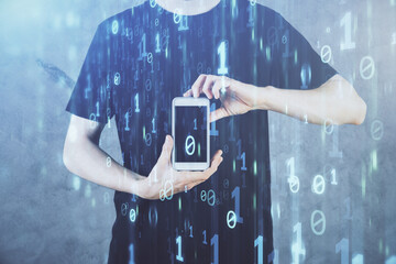 Double exposure of man's hand holding and using a digital device and data theme hologram drawing. Technology concept.