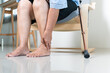 © PORNCHAI SODA - Ankle leg pain of senior woman at home, healthcare problem of senior concept