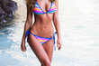 © yellowj - Woman in bikini at seaside