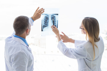 Wall Mural - Doctors examining x-ray film