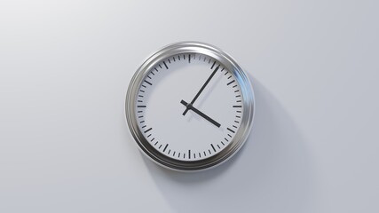 Glossy chrome clock on a white wall at six past four. Time is 04:06 or 16:06