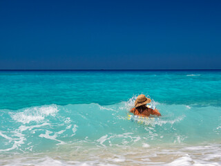 Wall Mural - Woman at the beach in Greece