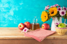 Jewish Holiday Rosh Hashana Background With Honey Jar, Apples And Sunflowers On Wooden Table. Kitchen Counter With Tablecloth And Copy Space For Product Display