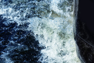 Motor boat engine in water, water at high speed