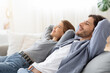 © Prostock-studio - Young chilling couple enjoying day off at home