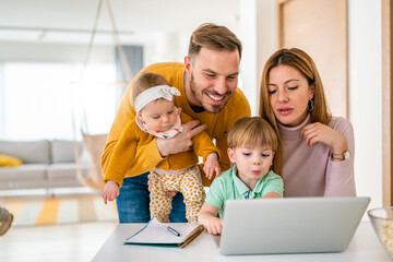 Poster - Happy smiling family chatting with computer together at home