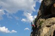© hsphto - Man climbing a mountain.