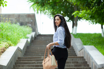 Poster - happy woman hand bag on the stairs