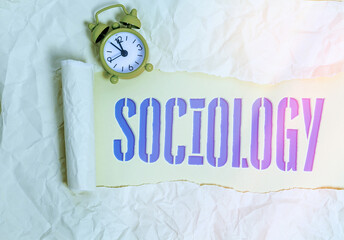 Handwriting text writing Sociology. Conceptual photo scientific analysis of a social institution as a functioning whole Rolled ripped torn cardboard placed above a wooden classic table backdrop