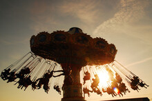 Folks Enjoy A Turn On The Swing Ride At Sunset In Point Pleasant, New Jersey