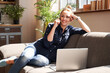 © Yakobchuk Olena - Contented lady enjoying pleasant phone conversation at home