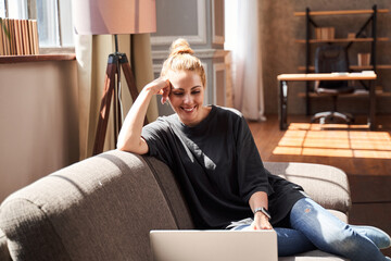 Smiling lady having appointment with psychologist online