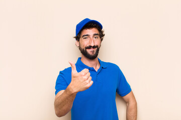 Poster - young cool bearded man. delivery man concept. proud or satisfact