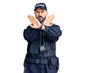 © Krakenimages.com - Young handsome man wearing police uniform rejection expression crossing arms doing negative sign, angry face