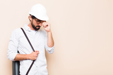 Wall Mural - young  bearded architect man confused or thinking