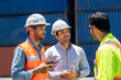 © visoot - Engineer and foreman worker working checking at Container cargo harbor to loading containers.