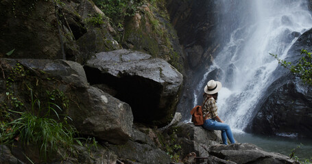 Sticker - Woman enjoy the waterfall in forest