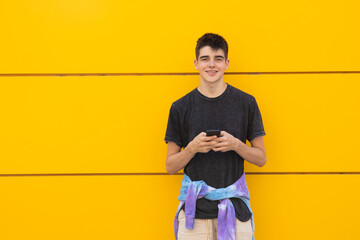 Poster - teenager on the city street with mobile phone