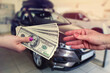 © RomanR - Buying a new car. The buyer and seller enter into an agreement to buy or lease a car