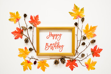 Wall Mural - golden frame with english text happy birthday. beautiful, colorful autumn leaf decoration with maple