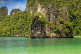 Fototapeta Natura - Eroded overgrown limestone rocks in Phang Nga Bay, Ao Phang Nga Marine National Park, Thailand,