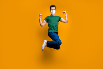 Sticker - Full length body size view of his he attractive sporty strong cool healthy guy wearing n95 mask jumping having fun stop mers cov pandemia success isolated vibrant yellow color background