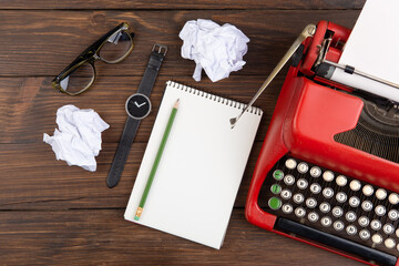 Poster - Writer or journalist workplace - vintage red typewriter, cassette recorder and notepad on the wooden desk