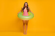 © deagreez - Full length body size view of her she nice attractive gorgeous stunned slim slender thin lady diving river water rubber ring isolated on bright vivid shine vibrant yellow color background