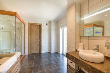 Interior of a hotel bathroom interior with shower cabin