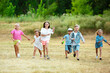 © master1305 - Kids, children running on meadow in summer's sunlight. Look happy, cheerful with sincere bright emotions. Cute caucasian boys and girls. Concept of childhood, happiness, movement, family and summer.