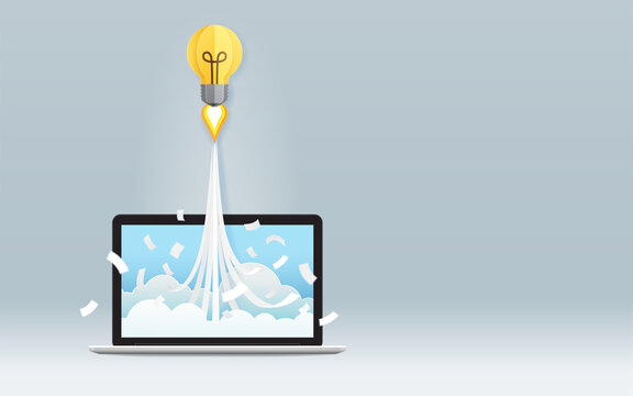 Startup business project concept with light bulb flying from laptop screen on gray background