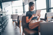 © Ekkarat - Attractive asian businesswoman using tablet at city cafe. Drinking coffee and surfing the internet and read news. social distancing concept.