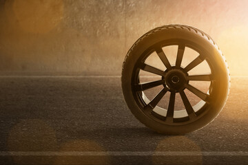 Wall Mural - Car tire on the road