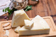 Pieces of matured pecorino romano italian cheese made from sheep milk in Lazio, Sardinia or Tuscany