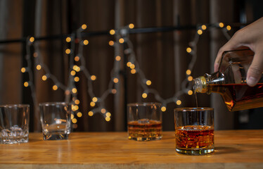 Bartender Serve Whiskey on wood bar