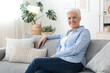 © Prostock-studio - Portrait of senior woman relaxing on sofa at home, enjoying retirement time