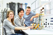© industrieblick - group of cheerful young students in vocational education and training for electronics