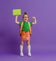 Wall Mural - Kid with backpack on color background.